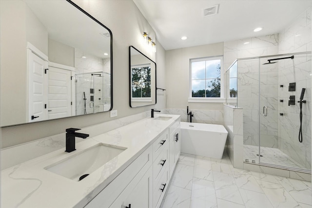807 Martin St Unit C, Houston, TX 77018 - full bathroom featuring a soaking tub, a marble finish shower, double vanity, marble finish flooring, and recessed lighting
