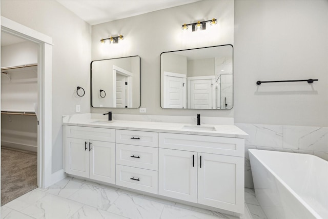 807 Martin St Unit C, Houston, TX 77018 - full bath with marble look tile flooring, double vanity, a spacious closet, a freestanding tub, and a shower
