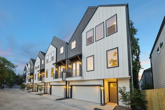 807 Martin St Unit C, Houston, TX 77018 - view of property featuring board and batten siding, a garage, and concrete driveway