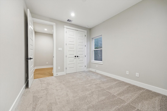 807 Martin St Unit C, Houston, TX 77018 - unfurnished bedroom featuring carpet, baseboards, a closet, and recessed lighting