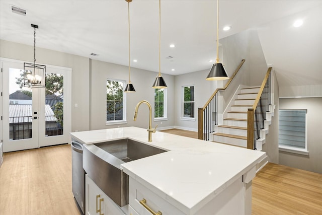 807 Martin St Unit C, Houston, TX 77018 - kitchen with a sink, light wood-type flooring, decorative light fixtures, light stone counters, and recessed lighting