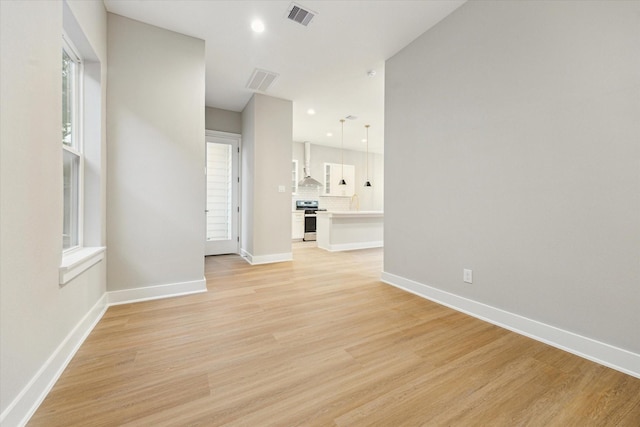807 Martin St Unit C, Houston, TX 77018 - spare room with light wood-type flooring, baseboards, and recessed lighting