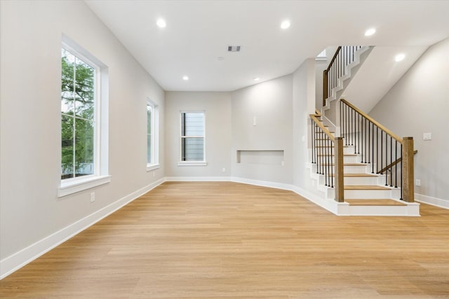 807 Martin St Unit C, Houston, TX 77018 - unfurnished living room with stairway, light wood-style flooring, recessed lighting, and baseboards