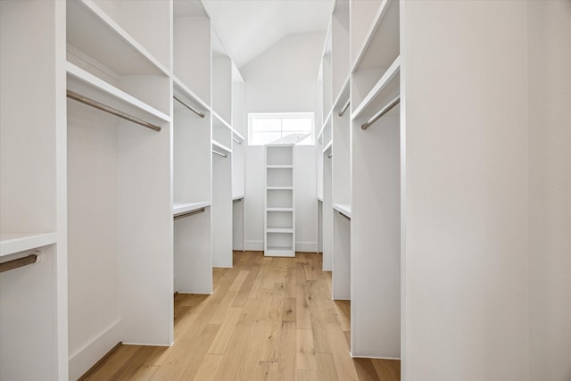 2209 Dennis St, Houston, TX 77004 - walk in closet with light wood finished floors and high vaulted ceiling