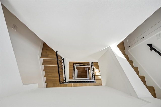 2209 Dennis St, Houston, TX 77004 - stairway featuring wood finished floors