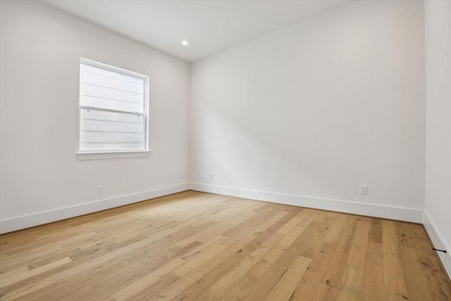 2209 Dennis St, Houston, TX 77004 - unfurnished room with hardwood / wood-style flooring, baseboards, and recessed lighting