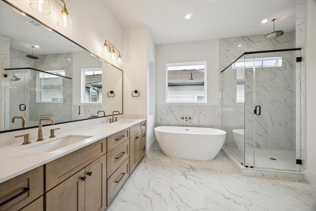 2209 Dennis St, Houston, TX 77004 - full bathroom featuring a marble finish shower, double vanity, marble tiled floors, and a freestanding bath