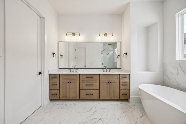 2209 Dennis St, Houston, TX 77004 - bathroom with marble finish flooring, a marble finish shower, a freestanding tub, and double vanity