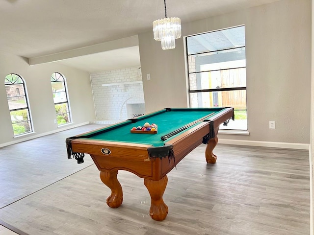 15730 Corsair Rd, Houston, TX 77053 - rec room featuring baseboards, wood finished floors, billiards table, beamed ceiling, and a chandelier