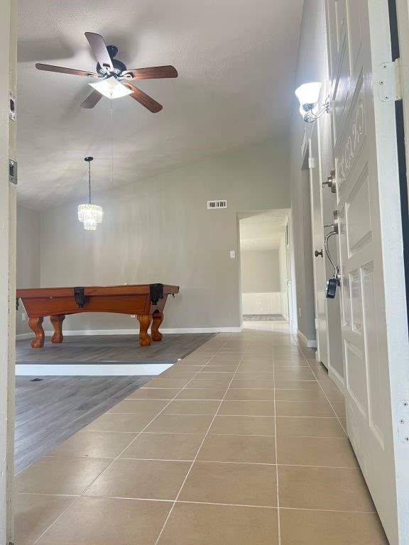 15730 Corsair Rd, Houston, TX 77053 - hall with vaulted ceiling, tile patterned floors, and baseboards