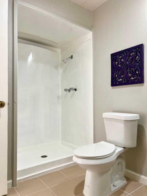 15730 Corsair Rd, Houston, TX 77053 - full bath featuring tile patterned floors, a shower stall, and toilet