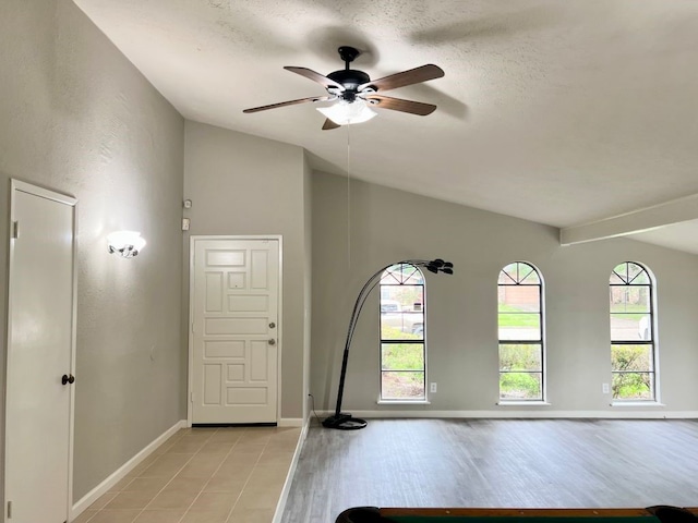 15730 Corsair Rd, Houston, TX 77053 - entrance foyer with lofted ceiling, ceiling fan, healthy amount of natural light, baseboards, and a textured ceiling