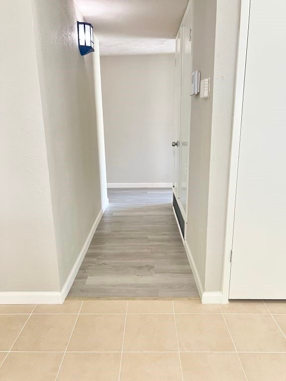 15730 Corsair Rd, Houston, TX 77053 - hall with tile patterned floors and baseboards