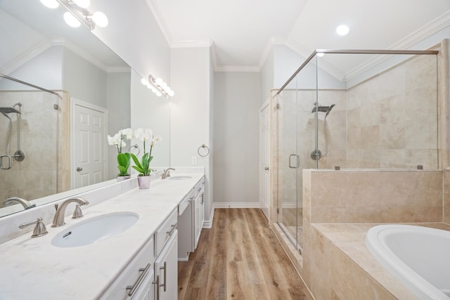 5741 Kansas St, Houston, TX 77007 - bathroom featuring a stall shower, a bath, crown molding, wood finished floors, and double vanity