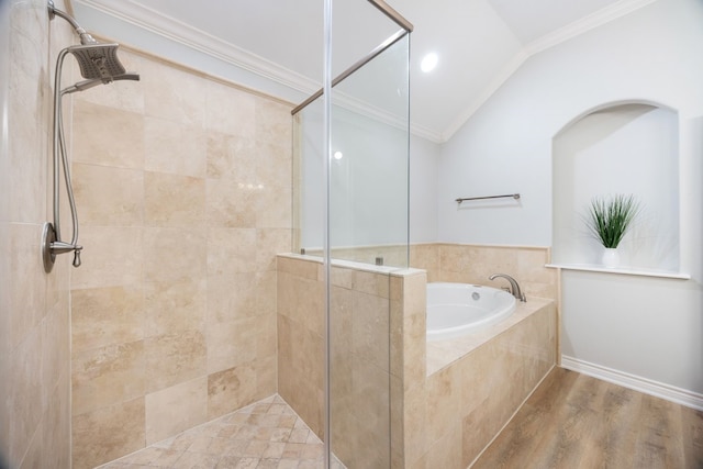 5741 Kansas St, Houston, TX 77007 - bathroom with a stall shower, a garden tub, ornamental molding, lofted ceiling, and wood finished floors