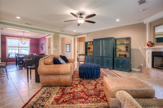 1912 Rollingwood Dr, Huntsville, TX 77340 - living area with light tile patterned flooring, ceiling fan, a large fireplace, ornamental molding, and recessed lighting