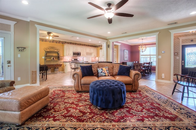 1912 Rollingwood Dr, Huntsville, TX 77340 - living room with ceiling fan, light tile patterned floors, a chandelier, baseboards, and ornamental molding