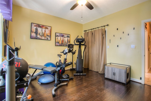 1912 Rollingwood Dr, Huntsville, TX 77340 - workout room with a ceiling fan, dark wood-style floors, and baseboards