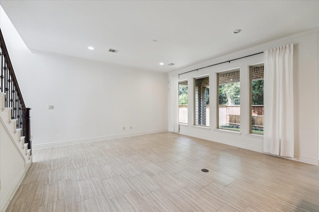 35 Daffodil Meadow Pl, Tomball, TX 77375 - spare room with stairs, baseboards, and recessed lighting