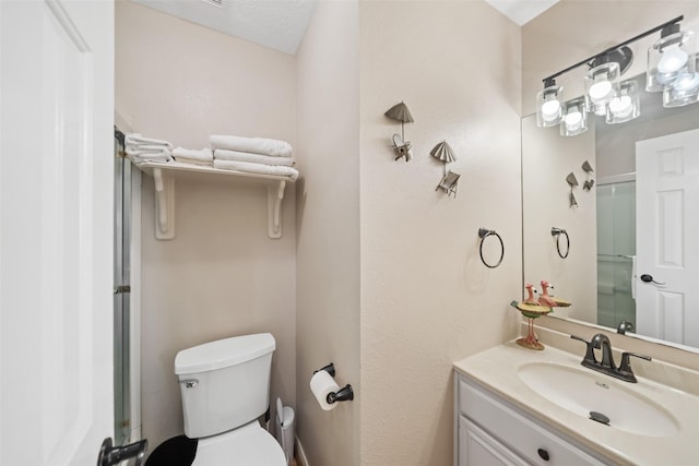 109 Fm-2031, Matagorda, TX 77457 - bathroom featuring toilet, a shower with door, and vanity
