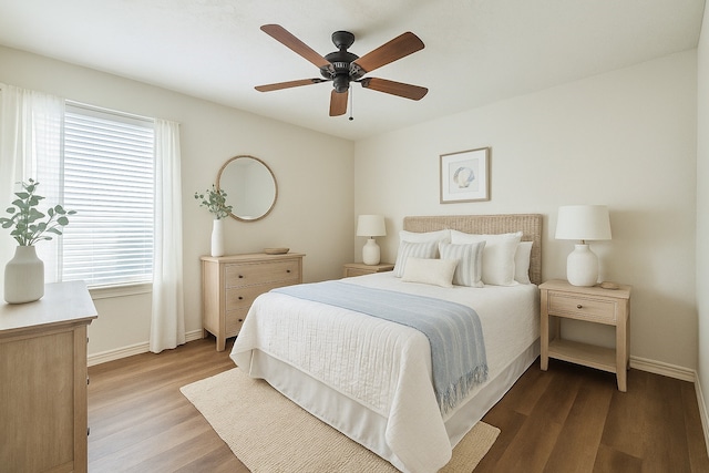 7205 Yucca Dr, Galveston, TX 77551 - bedroom featuring wood finished floors, baseboards, and a ceiling fan