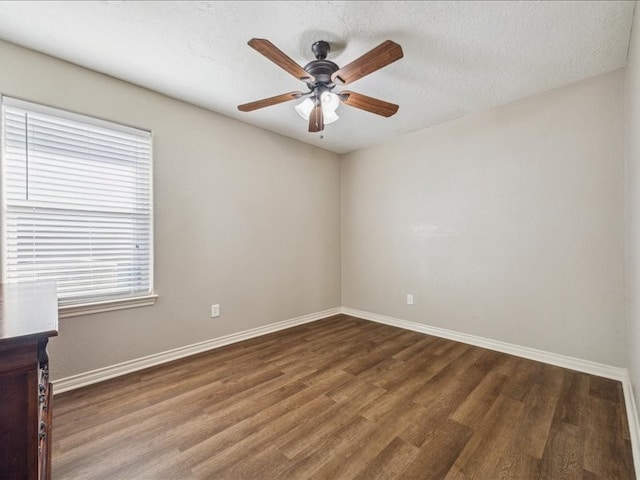 7205 Yucca Dr, Galveston, TX 77551 - unfurnished room featuring baseboards, wood finished floors, a ceiling fan, and a textured ceiling