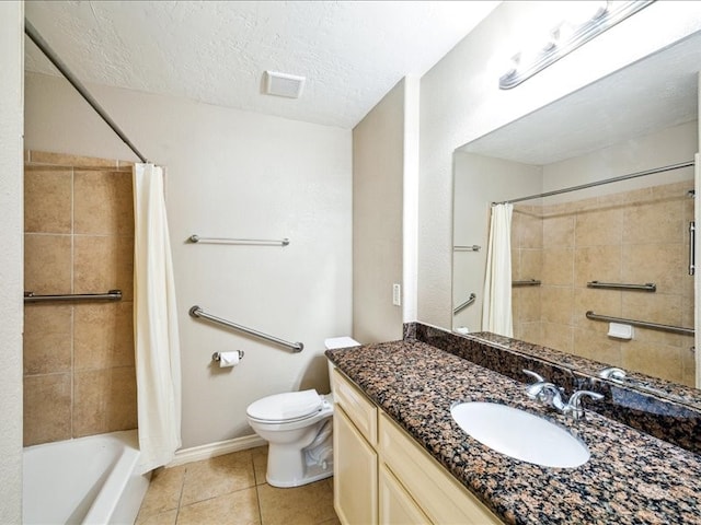 7205 Yucca Dr, Galveston, TX 77551 - full bath featuring toilet, tile patterned flooring, vanity, a textured ceiling, and shower / tub combo with curtain
