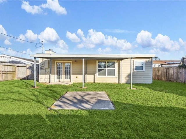 7205 Yucca Dr, Galveston, TX 77551 - back of property featuring french doors and a patio