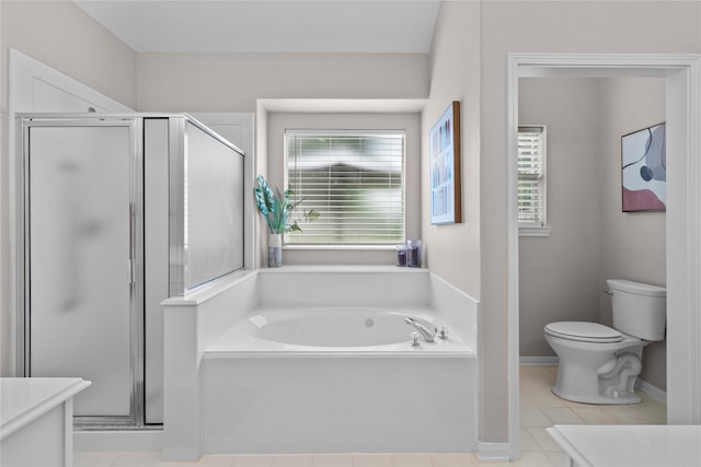 1608 Lark St, Alvin, TX 77511 - bathroom featuring vanity, a bath, toilet, a stall shower, and tile patterned flooring