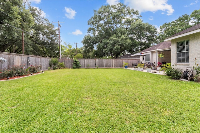 1608 Lark St, Alvin, TX 77511 - view of yard featuring a patio area