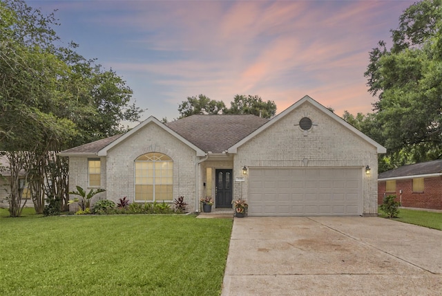 1608 Lark St, Alvin, TX 77511 - single story home with a garage, concrete driveway, a front yard, brick siding, and a shingled roof