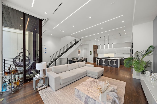 819 W 24th St Unit C, Houston, TX 77008 - living room featuring dark wood finished floors, stairs, and recessed lighting
