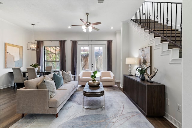 3615 Hempstead Villa Dr, Houston, TX 77008 - living area featuring crown molding, wood finished floors, baseboards, ceiling fan, and stairs