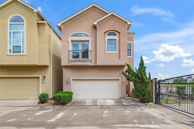 3615 Hempstead Villa Dr, Houston, TX 77008 - view of front of property with an attached garage, driveway, stucco siding, and a gate