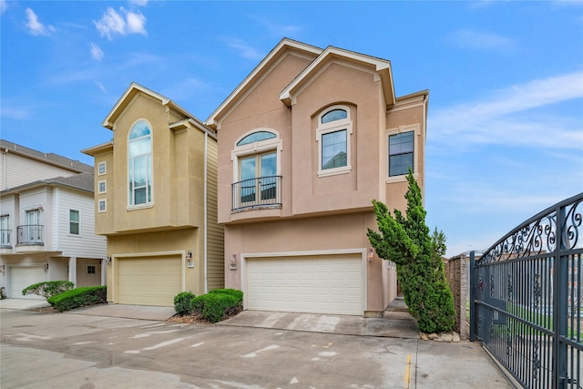 3615 Hempstead Villa Dr, Houston, TX 77008 - multi unit property featuring a balcony, a garage, stucco siding, and concrete driveway