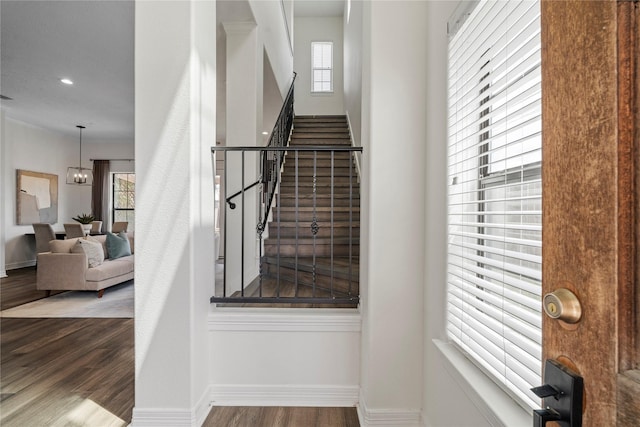 3615 Hempstead Villa Dr, Houston, TX 77008 - stairway with wood finished floors, a chandelier, baseboards, and recessed lighting