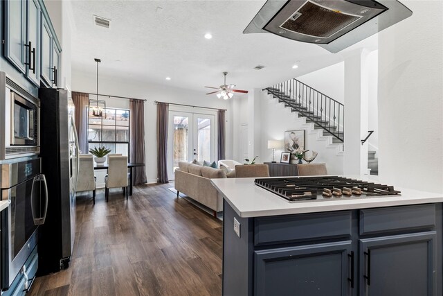 3615 Hempstead Villa Dr, Houston, TX 77008 - kitchen with appliances with stainless steel finishes, light countertops, dark wood-style flooring, recessed lighting, and open floor plan