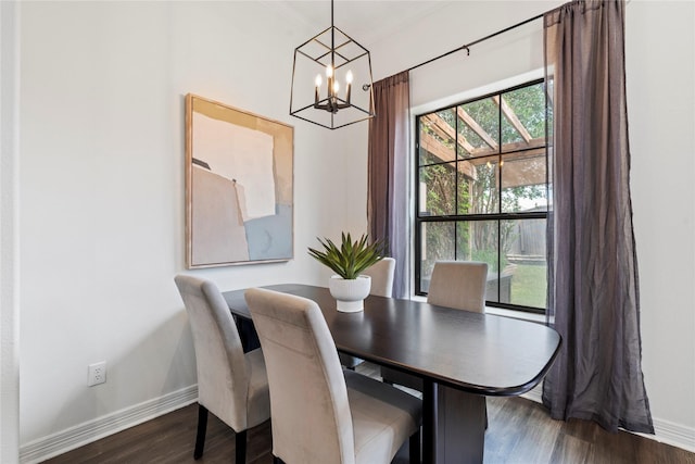 3615 Hempstead Villa Dr, Houston, TX 77008 - dining area featuring baseboards, a chandelier, and dark wood-type flooring