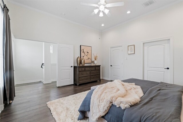 3615 Hempstead Villa Dr, Houston, TX 77008 - bedroom with dark wood-style flooring, recessed lighting, ornamental molding, a towering ceiling, and baseboards