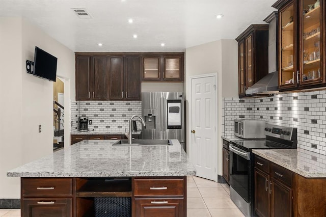8506 Regalbrook Dr, Houston, TX 77095 - kitchen featuring appliances with stainless steel finishes, a sink, tasteful backsplash, light tile patterned floors, and recessed lighting