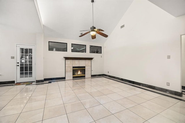 8506 Regalbrook Dr, Houston, TX 77095 - unfurnished living room with a ceiling fan, high vaulted ceiling, baseboards, a fireplace, and light tile patterned floors