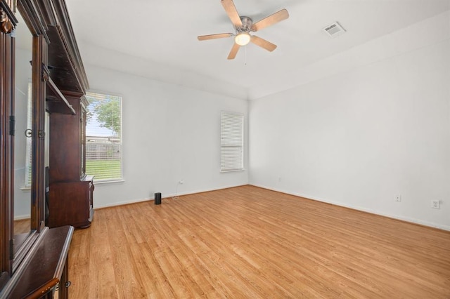 8506 Regalbrook Dr, Houston, TX 77095 - unfurnished room with light wood-type flooring, a ceiling fan, and baseboards