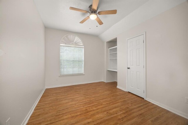 8506 Regalbrook Dr, Houston, TX 77095 - unfurnished bedroom with light wood-type flooring, baseboards, and ceiling fan