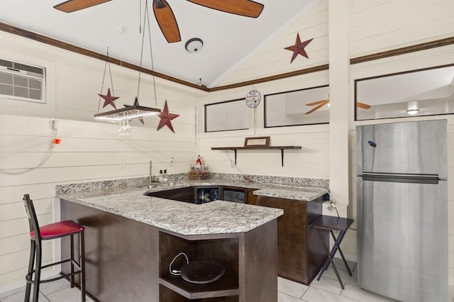8506 Regalbrook Dr, Houston, TX 77095 - kitchen featuring open shelves, vaulted ceiling, freestanding refrigerator, a ceiling fan, and light stone counters