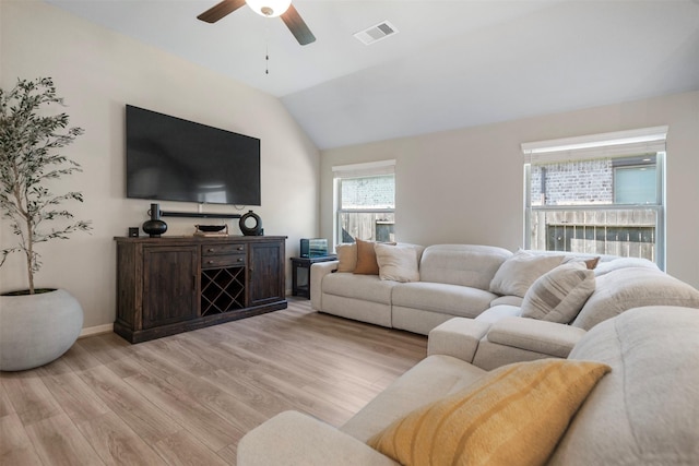 4607 Primrose Valley Ln, Fulshear, TX 77441 - living area with a ceiling fan, light wood-type flooring, vaulted ceiling, and baseboards