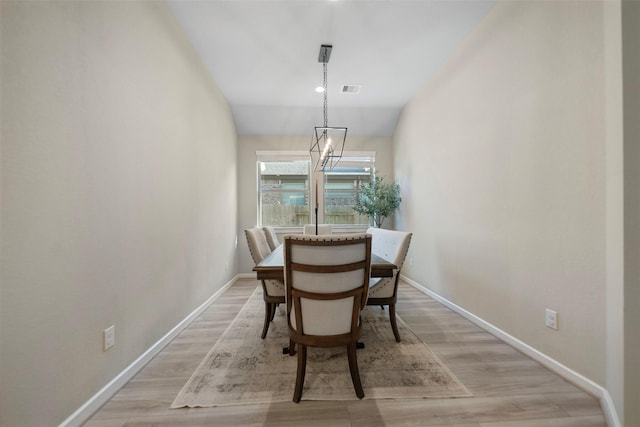 4607 Primrose Valley Ln, Fulshear, TX 77441 - dining area featuring light wood-style floors, baseboards, and vaulted ceiling