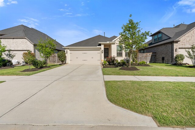 4607 Primrose Valley Ln, Fulshear, TX 77441 - view of front facade with driveway and a garage