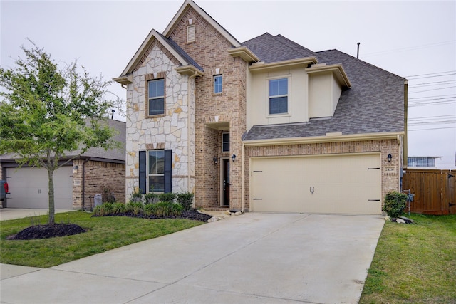 24210 Leonforte Dr, Richmond, TX 77406 - view of front of property with roof with shingles, brick siding, and driveway