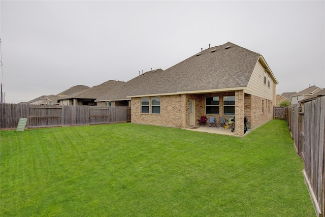 24210 Leonforte Dr, Richmond, TX 77406 - rear view of property featuring brick siding, a shingled roof, and a patio