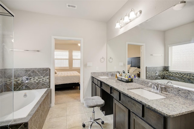 24210 Leonforte Dr, Richmond, TX 77406 - ensuite bathroom with double vanity, a bath, and tile patterned flooring